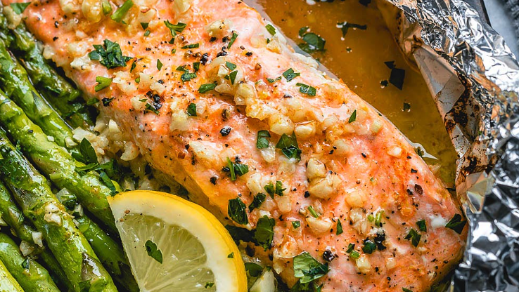 Image of Baked Salmon and Asparagus in Foil with Lemon Garlic Butter Sauce