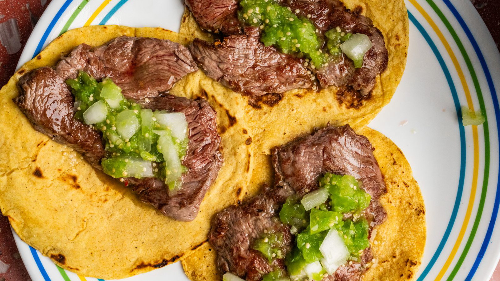 Taco gaonera topped with salsa cruda and onion