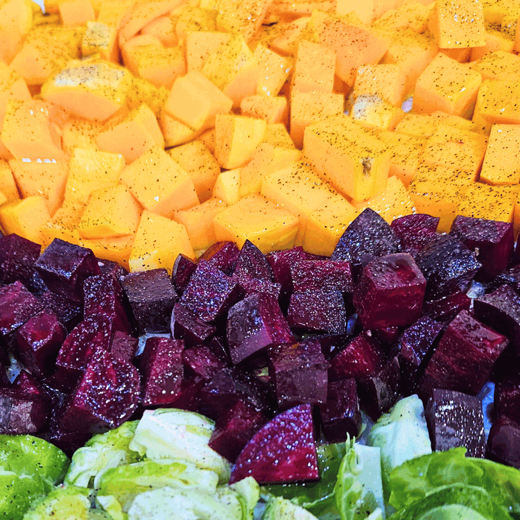 Image of Place the beets and squash, and optional Brussels sprouts on a parchment-lined baking sheet. Drizzle with olive oil and season with salt and pepper. Roast for 25-20 min until the squash is cooked through.