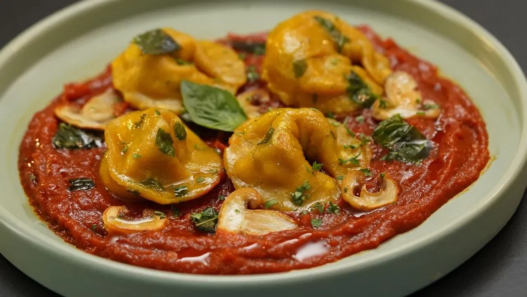 Image of Momo Ravioli In A Spicy Marinara Sauce