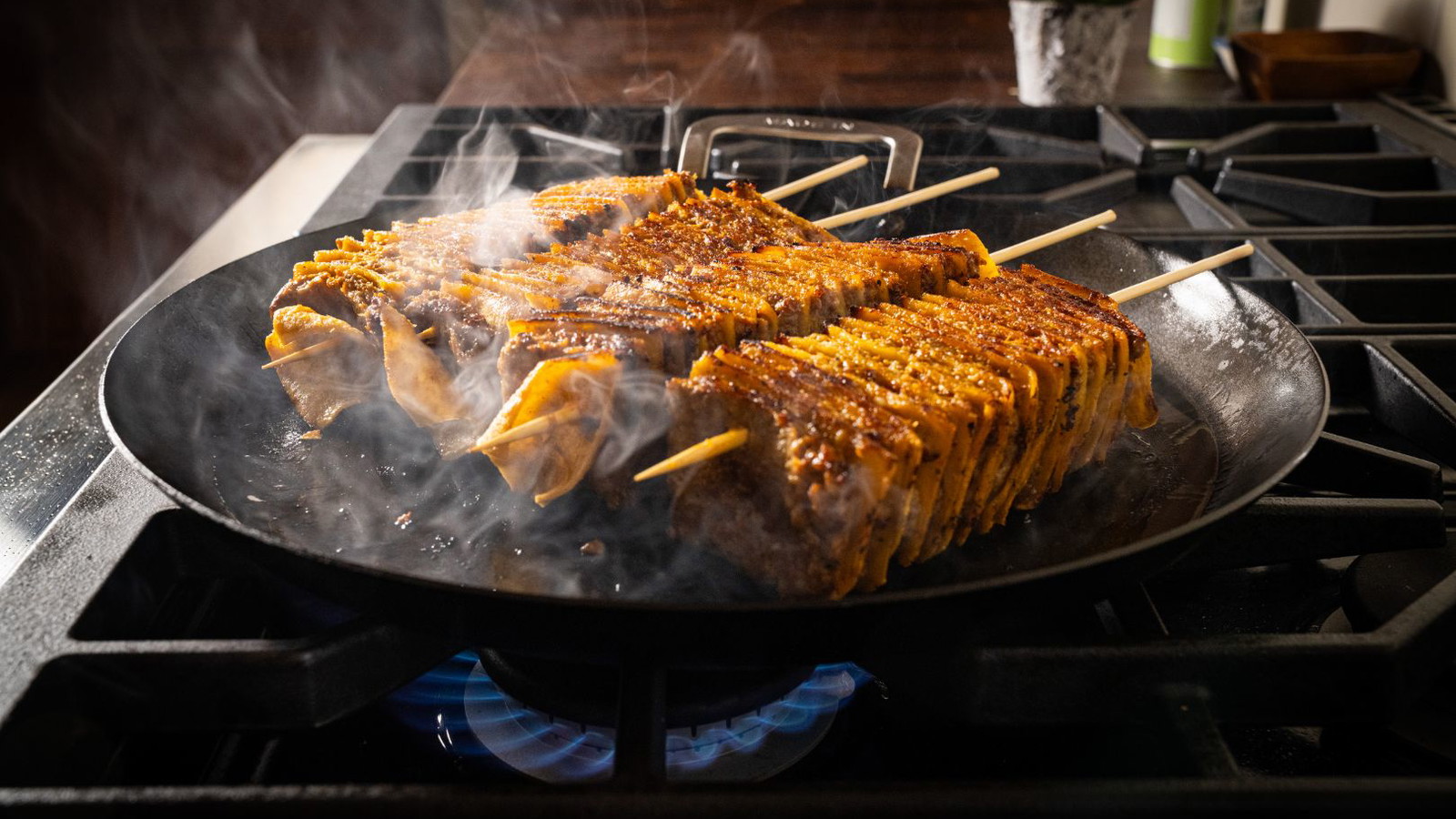 Chorizo Tortilla Skewers cooking on a comal
