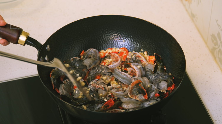 Image of Some of you are probably wondering why I only added half of the garlic? The first half of the garlic will turn golden brown as the shrimp cooks. We will add the rest of the garlic at the end and...