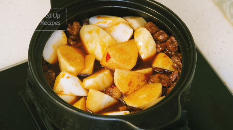 Image of Add the daikon radish into the pot and let it simmer...