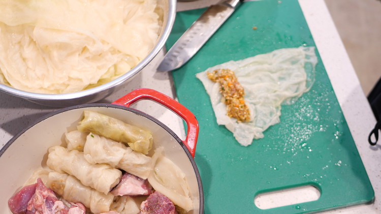 Image of Lay a cabbage leaf flat on a clean surface.