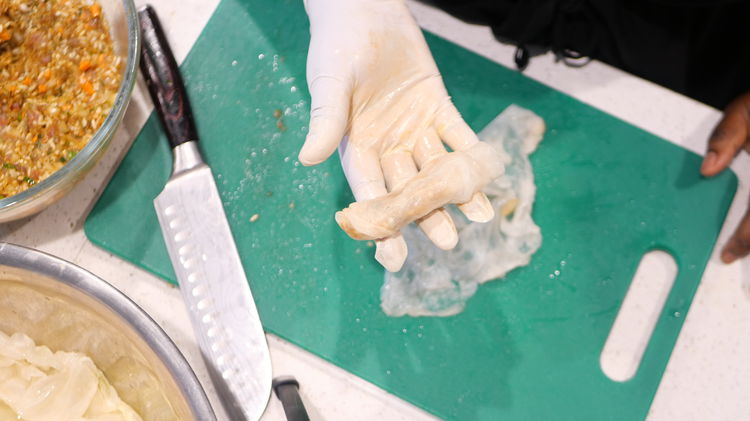 Image of Spoon 1–2 tablespoons of filling along the base, fold in...