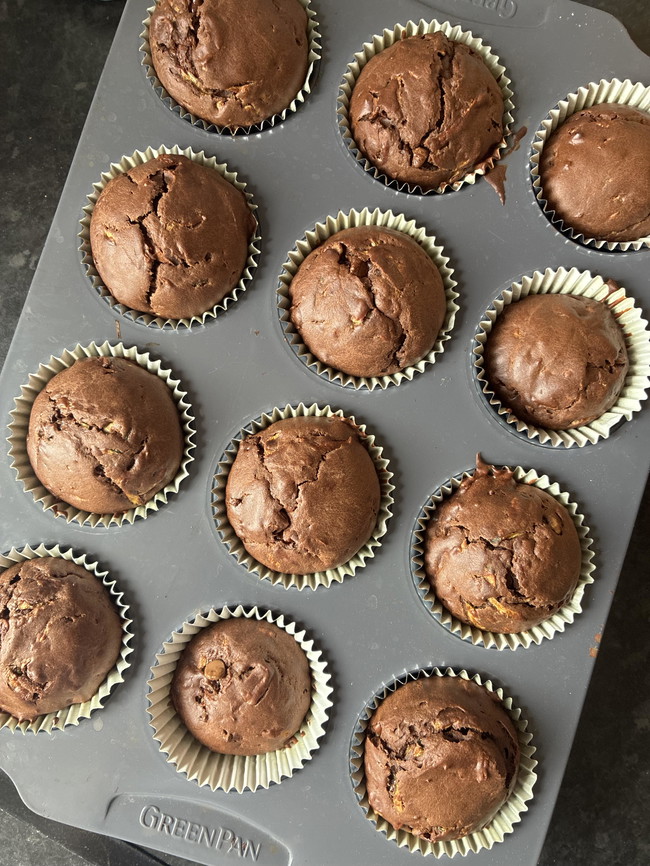 delicious looking vegetable chocolate muffins in a muffin tin