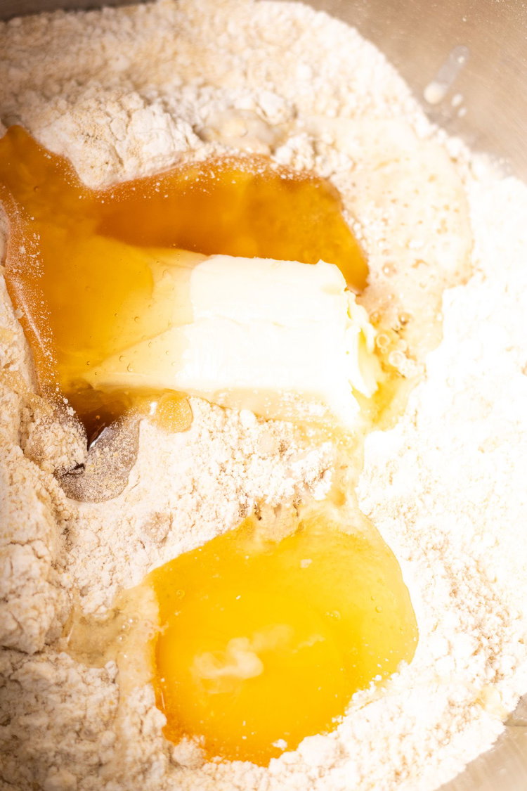 Image of Add in milk, honey, egg and butter that is melted.