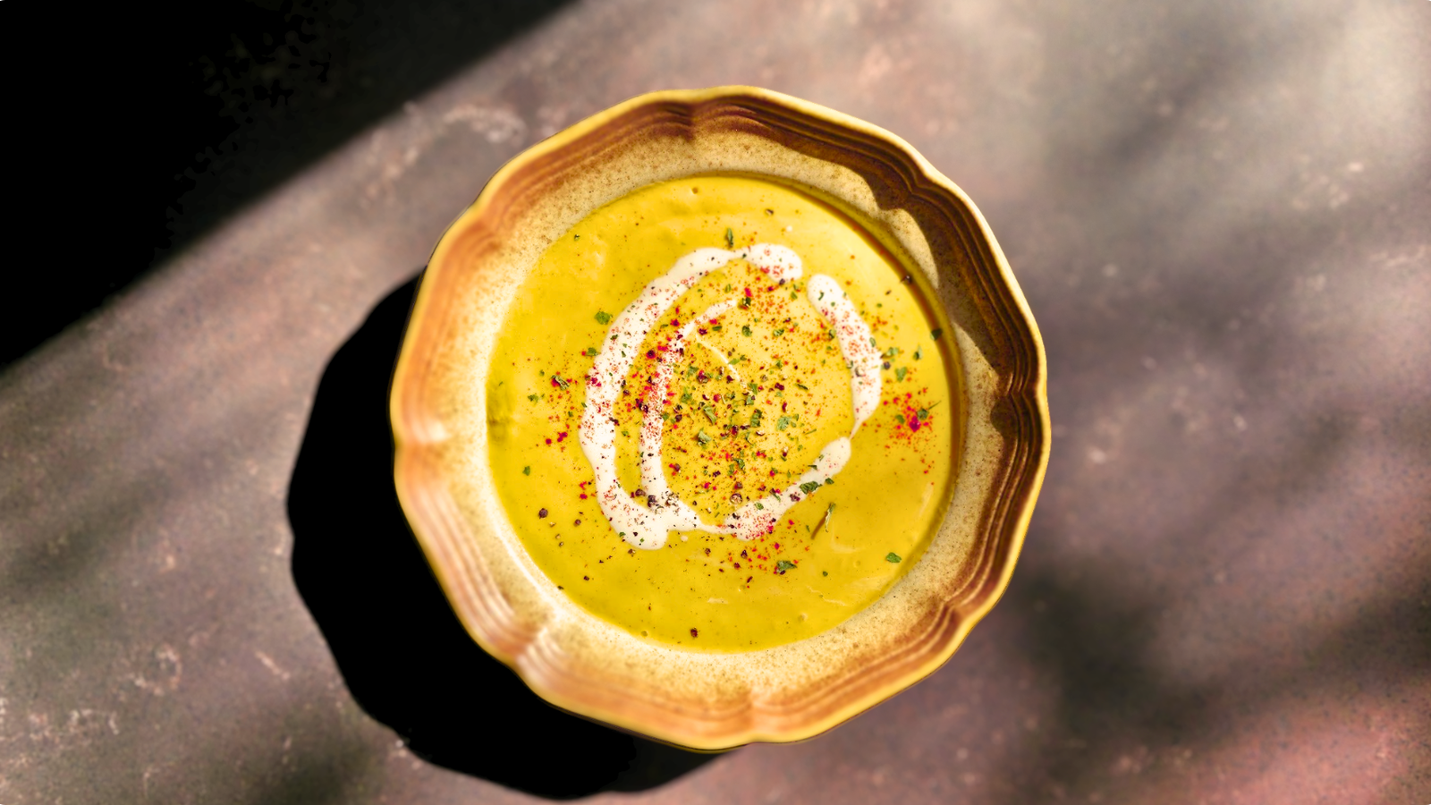 image of butternut squash soup in a scalloped soup bowl 