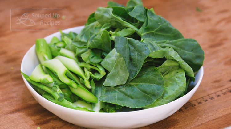 Image of During this time, separate the gailan (Chinese broccoli) stems and...