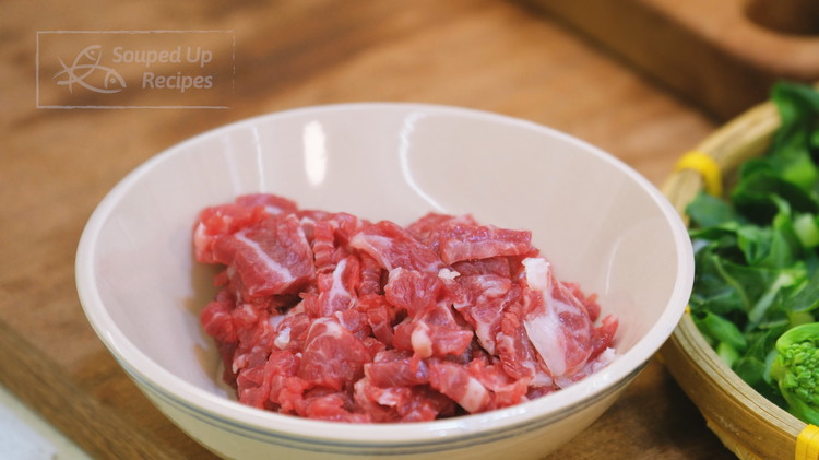 Image of Cut the beef into a few thick strips, then slice them into thin pieces. We will not marinade the meat so you do want to use a tender cut, such as flank steak, sirloin or strip steak.
