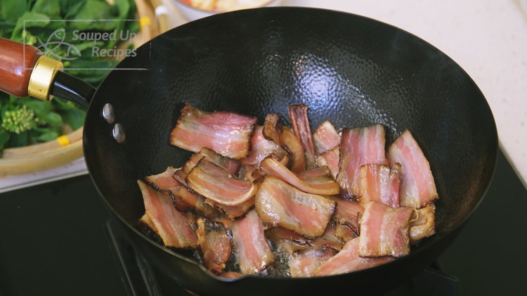 Image of Turn the heat to medium and preheat the wok for 20-30 seconds. Add a drizzle of oil to lubricate the wok surface. Then toss in the sliced Chinese cured meat. Stir over medium low heat for a couple of minutes...