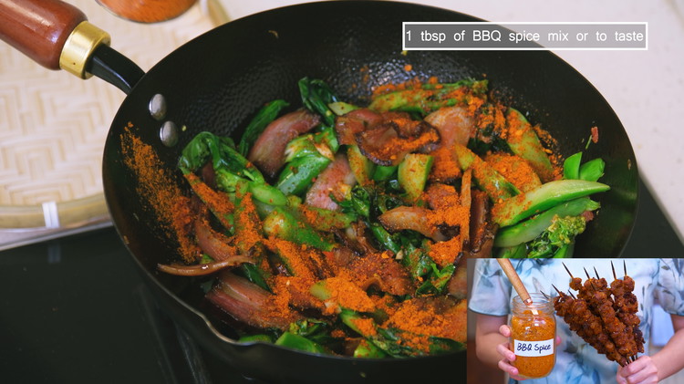 Image of Add the gailan stems and some diced garlic and stir-fry for 4–5 minutes, or until they’re just cooked through. Season it with 1 tbsp of Chinese BBQ spice mix and enjoy! Feel free to use your own favorite seasoning blend—just...