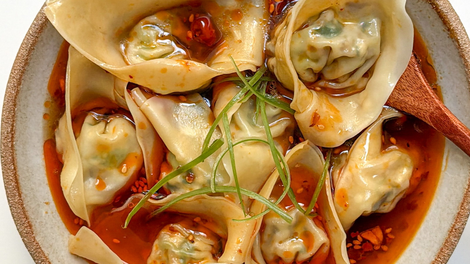Image of Vegan wontons in spicy and sour broth. 丨酸辣素馄饨