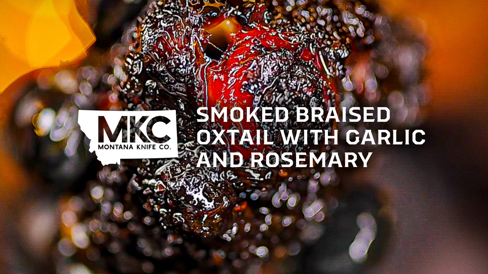 Close-up of smoked braised oxtail with garlic and rosemary.