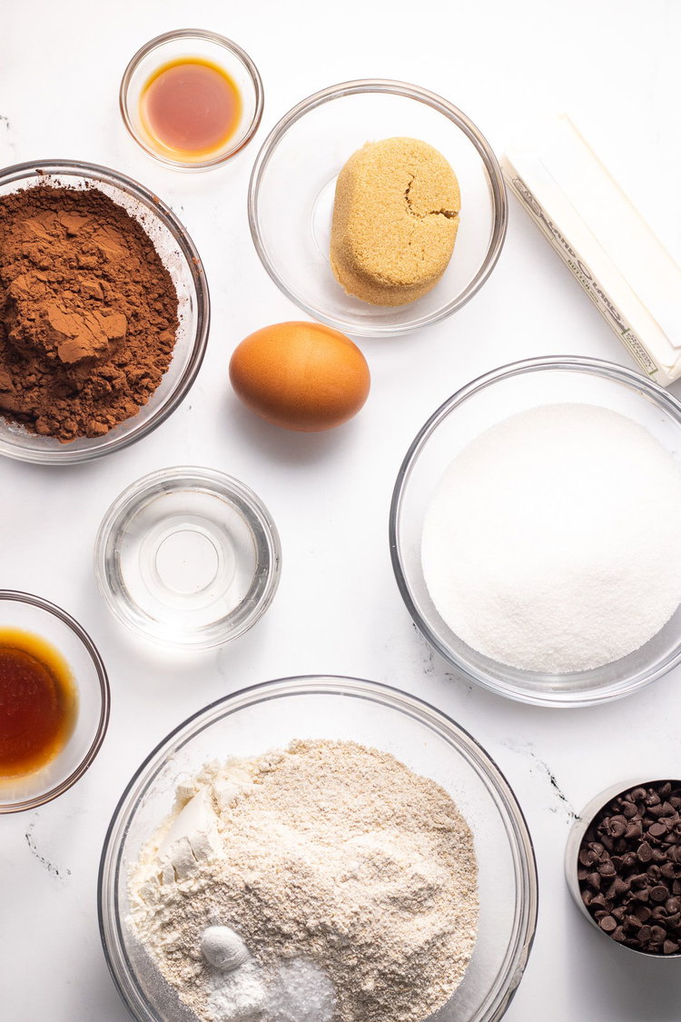 Image of Mix together melted butter, oil, sugars and cocoa powder.
