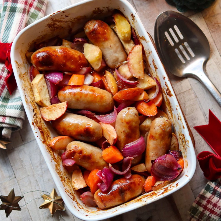 Image of Pour over the tray, turn
everything well, and roast for another 20 minutes until the sausages are glazed
and the vegetables are golden and sticky.