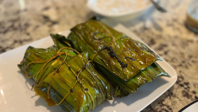 Image of Salmon wrapped in banana leaf 