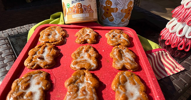 Soft healthy gluten-free gingerbread donuts shaped like gingerbread men with cashew butter, maple glaze