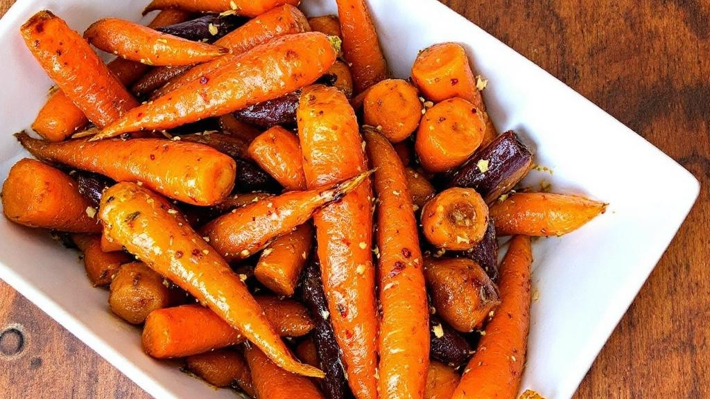 Roasted heritage carrots glazed with honey and Garlic Chilli Oil — sweet and spicy Filipino-inspired Christmas side dish.