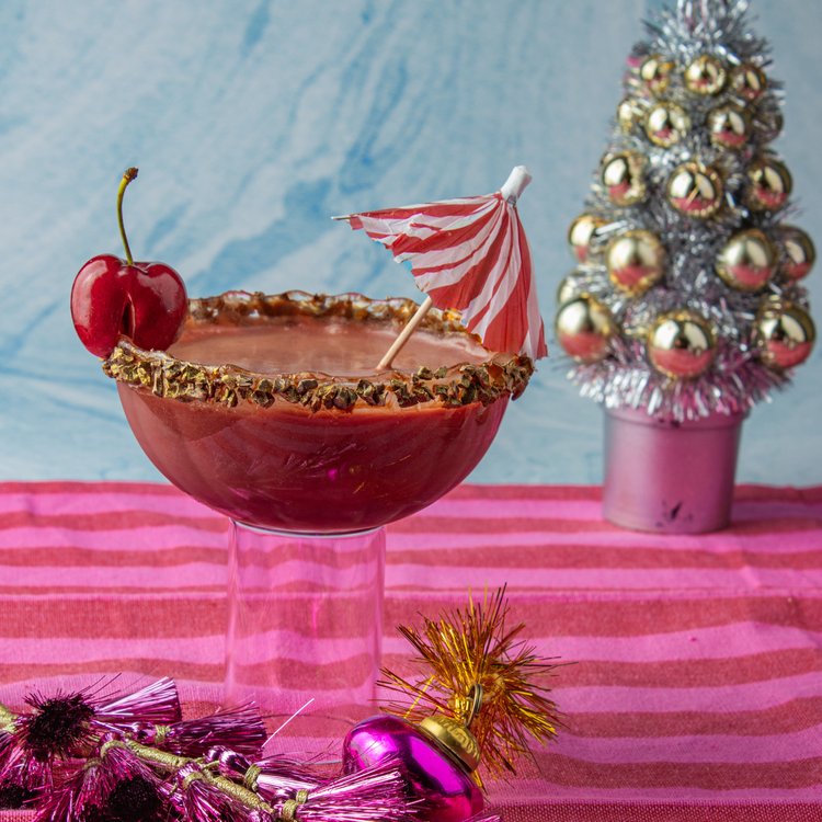Image of To garnish, cut a slit
in a cherry and perch it on top of the glass. Cocktail umbrella optional!