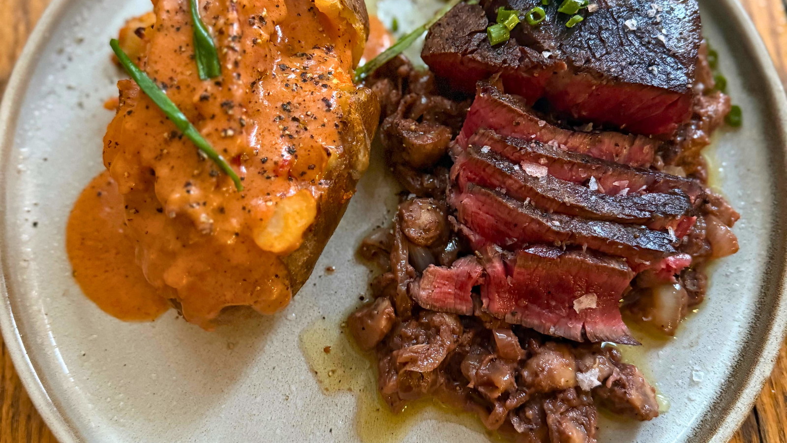 Image of The GOAT of Surf & Turf: Steak Diane with loaded lobster bisque potatoes 