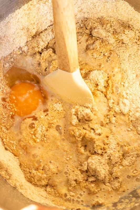 Image of In a large bowl, mix together eggs, warm water, sugar,...