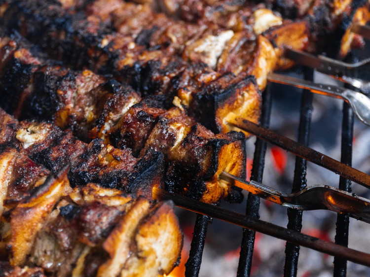 Image of paint the marinade on the skewers before grilling them and then it’s time to hot the coals. A medium heat on those coals is best, if they are really hot the pita will burn too quickly. Just a few minutes...