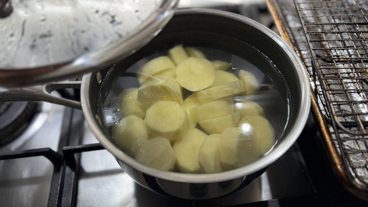 Image of boil spuds until fork tender and almost falling apart