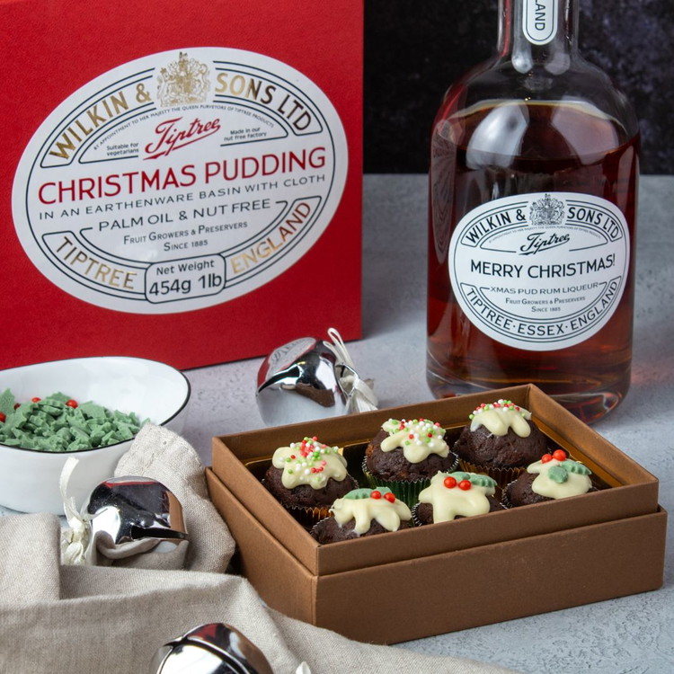 Image of Decorate the tops of the truffles with mini holly and berry sprinkles or any festive sprinkles. Do this individually and quickly before the chocolate sets. If you don’t have sprinkles, use thyme leaves, cranberries, or glacé cherries, cut up into...