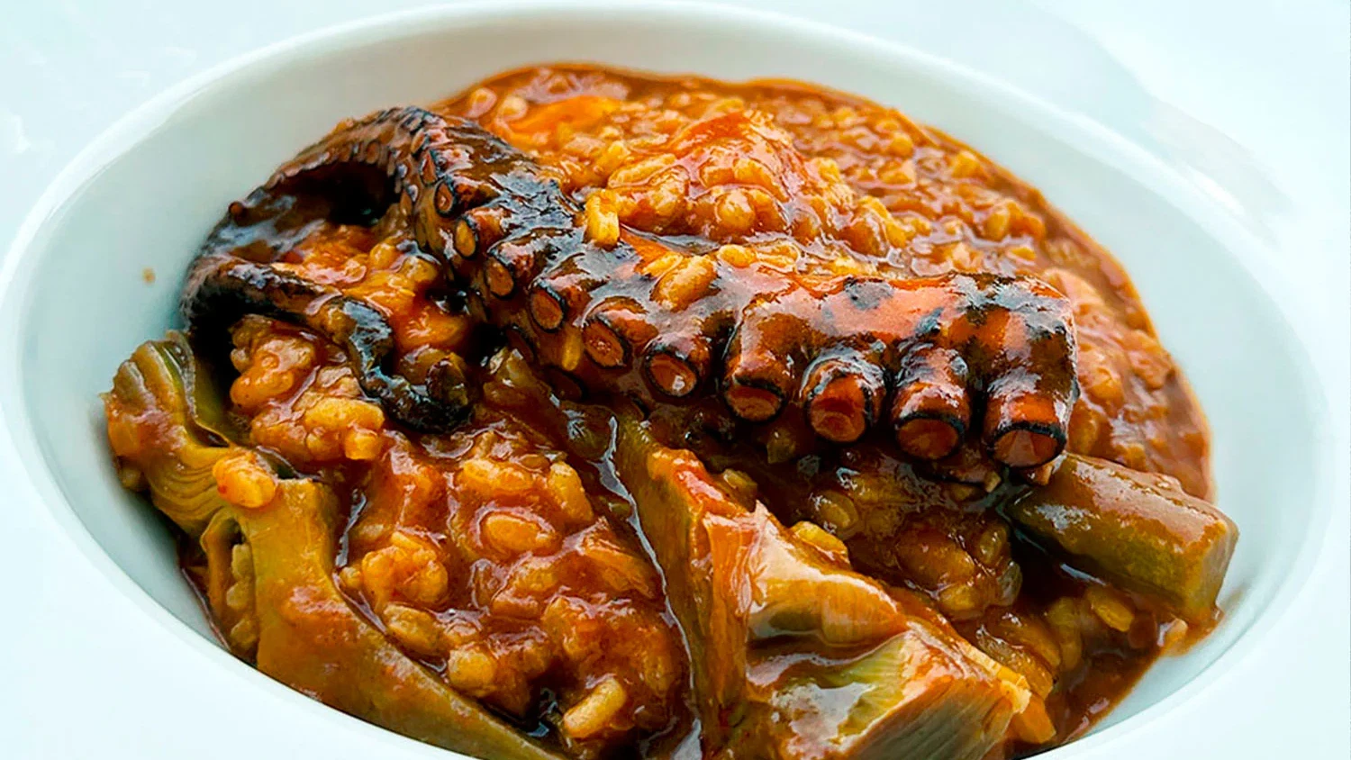 Image of Arroz meloso con pulpo y alcachofas