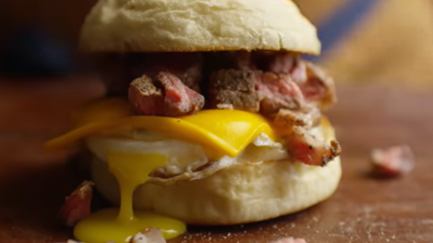Diced ribeye on an English muffin with egg and cheese