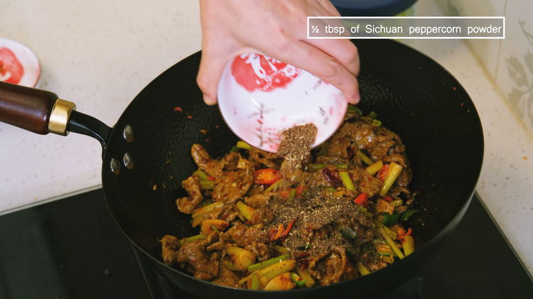 Image of Introduce the beef back into the wok. Continue by adding...