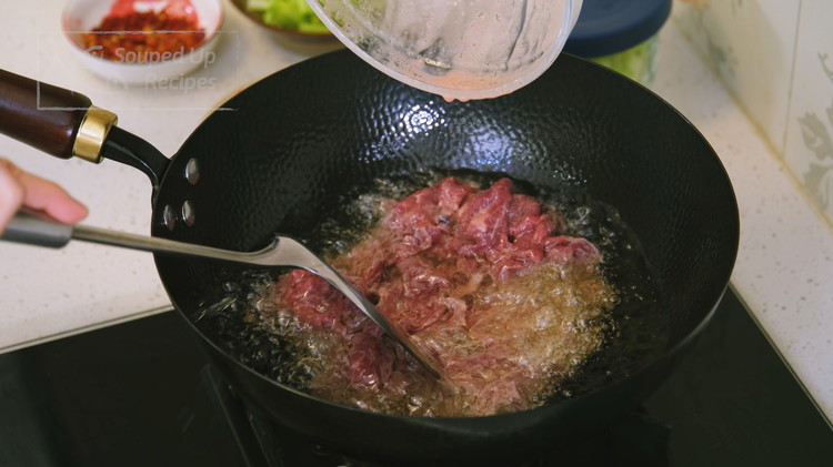 Image of Once the beef is done marinating, we can start the huayou technique. Heat the wok to smoking hot and add 1.5 cups of oil. Bring the oil to 320 F over medium heat. Do not overheat the oil because we...