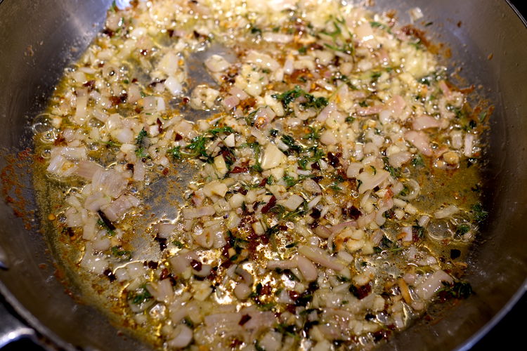 Image of Add red pepper, garlic, shallots, thyme to chicken fat and...