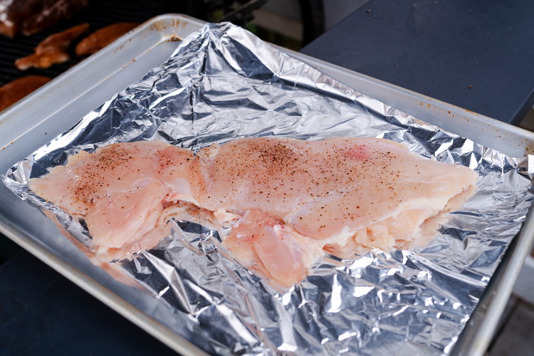 Image of Add a few good pinches of salt and pepper to each side and let it rest in a bowl while you fire up the grill. This will give time for the salt to penetrate the meat and make it even...