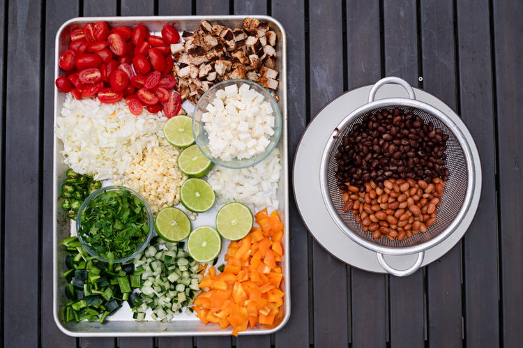 Image of Chop and add all salad ingredients into a bowl. Chop...