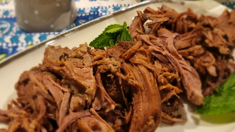 Slow-cooked Lamb with Black Garlic BBQ Sauce on a plate