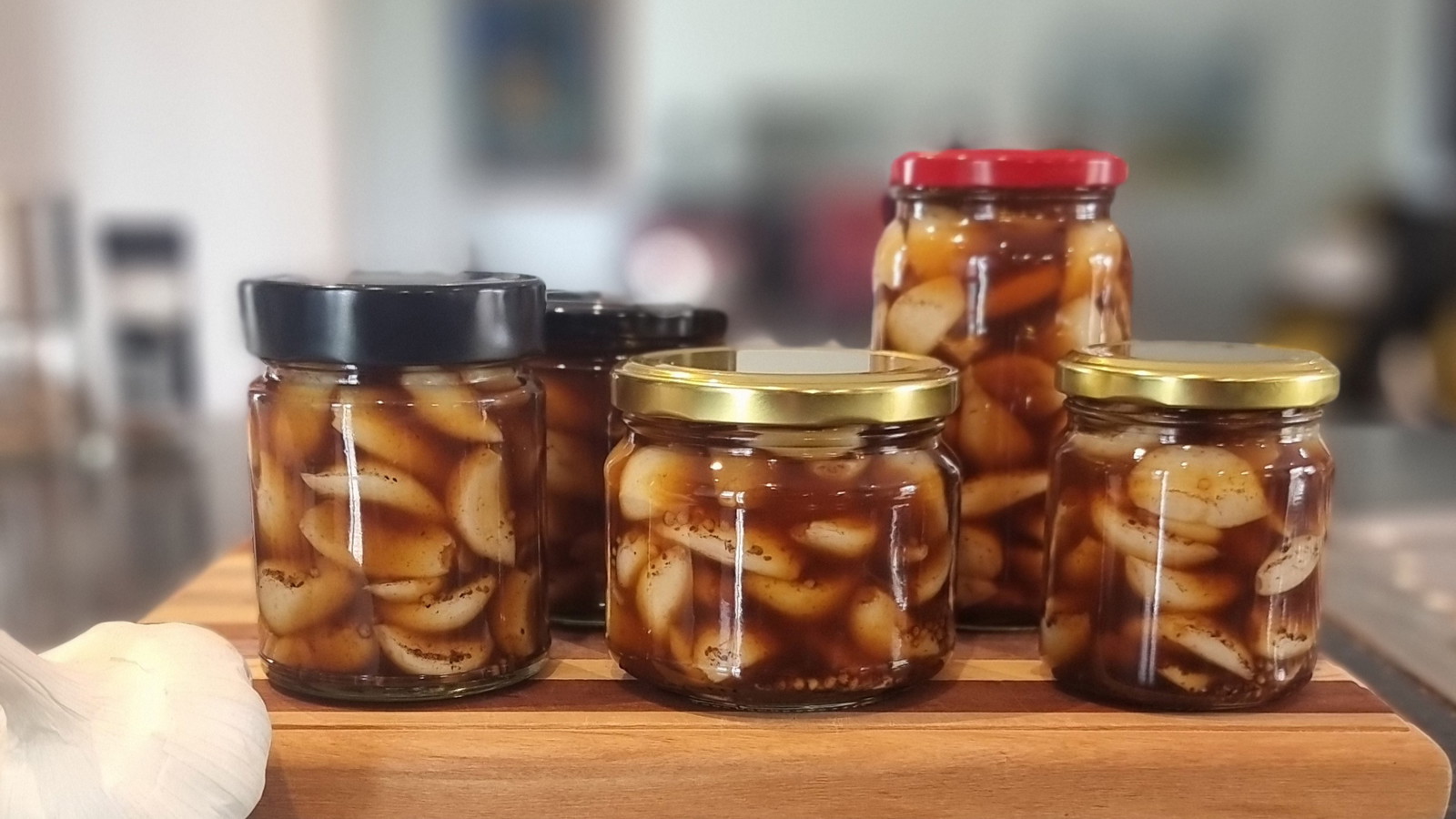 Fresh Garlic pickled with Black Honey in jars