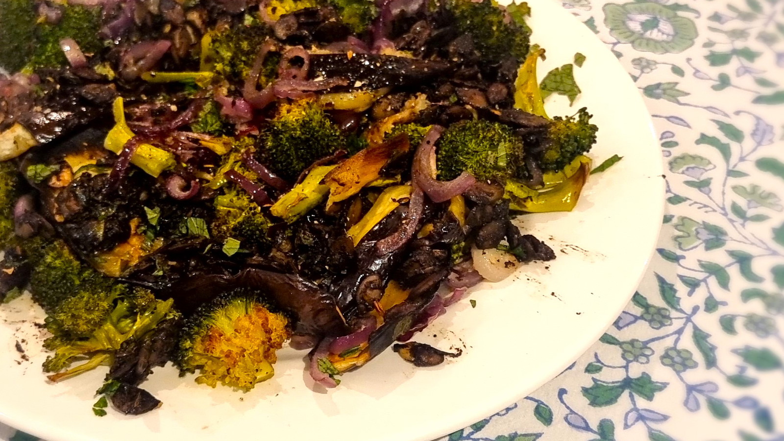 Black Garlic, Broccoli, Eggplant and Mint on a plate