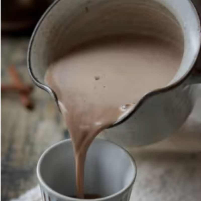 Mexican hot chocolate poured into white mug