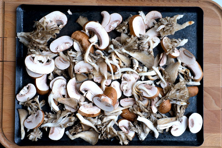 Image of Arrange cleaned, cut mushroom on a baking sheet.  Note that...