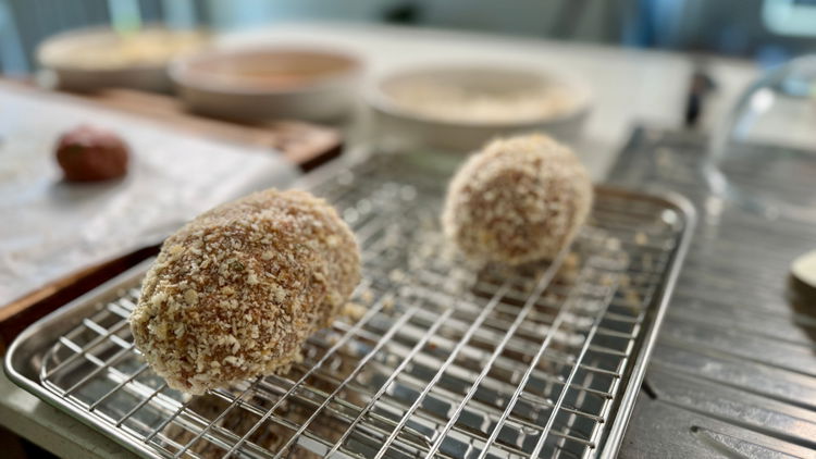 Image of now use the dredge station to coat the balls. Flour,...