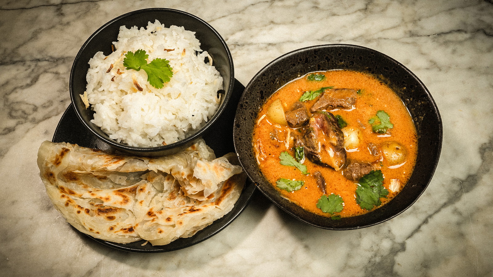 Venison massaman curry, steamed rice & buttered paratha