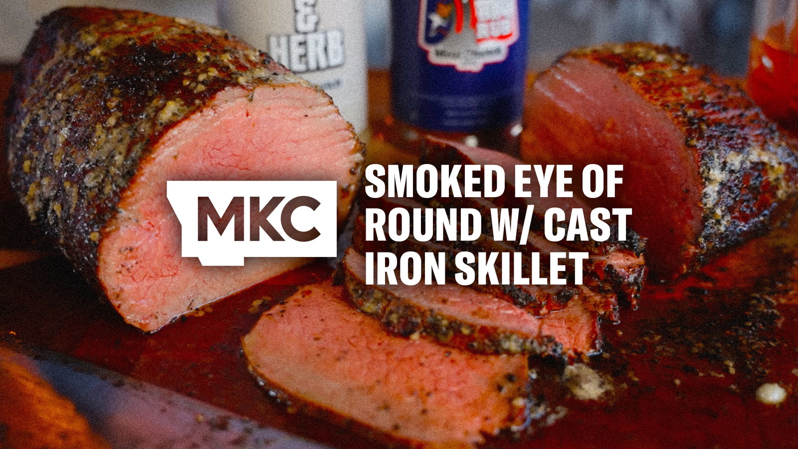 Juicy eye of round roast sliced thin, showing a seasoned crust from cast iron searing and slow smoking.