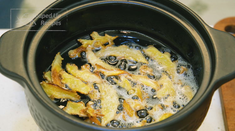 Image of Add the ginger slices and sesame oil to a pot...