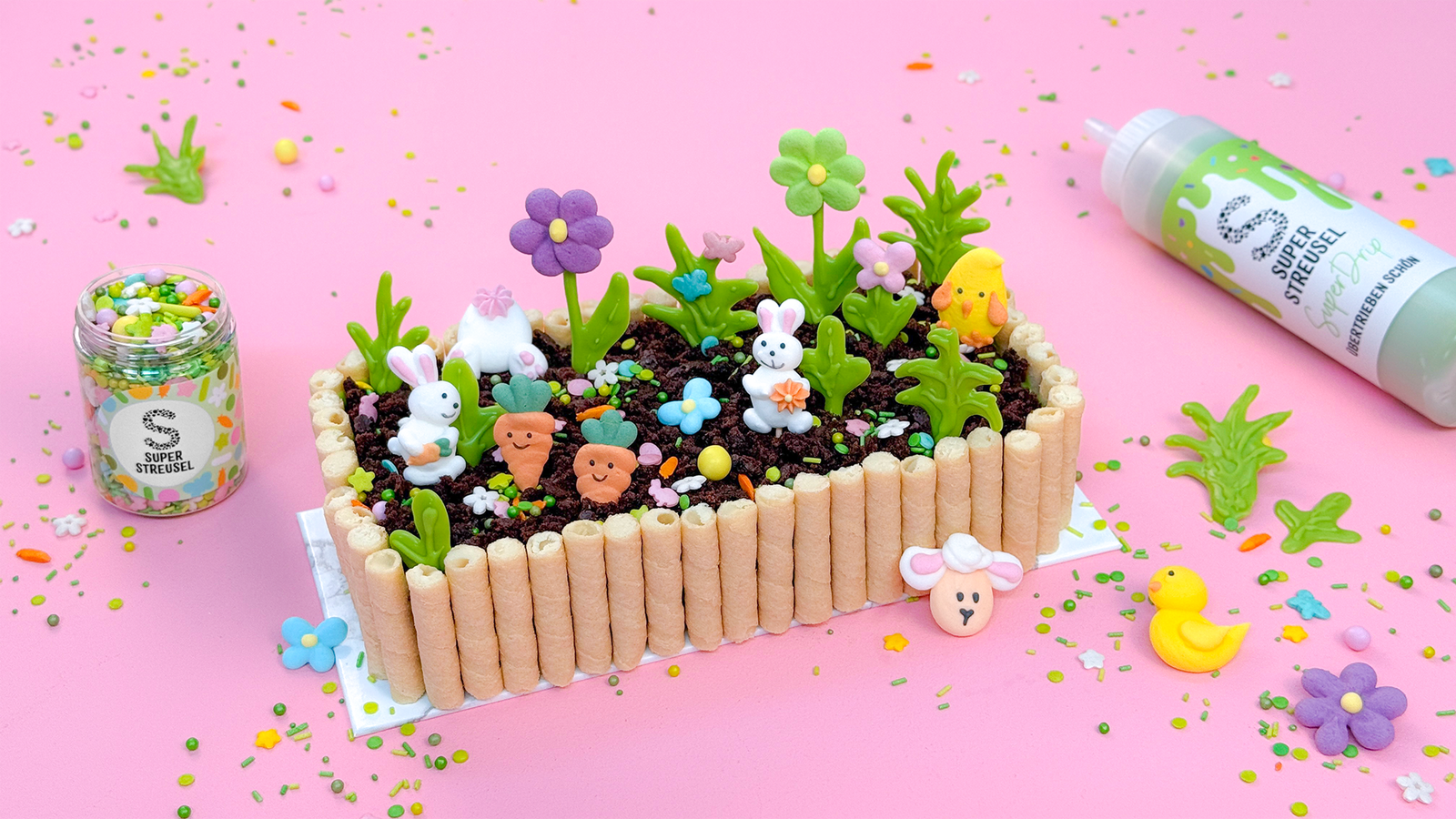 Blumenbeet Brownie mit Waffelröllchen-Zaun, SuperDrip Limettengrün und StreuselMix FrühlingsFlitzer als essbares Oster-Gärtchen.
