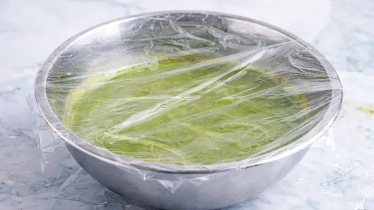 Image of Cover the bowl tightly with plastic wrap and place it...