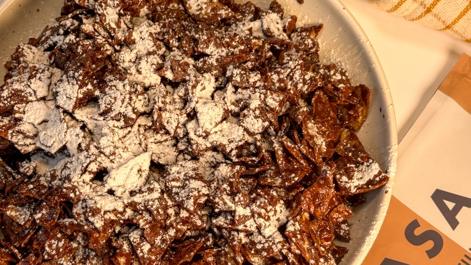 Puppy chow using cinnamon-sugar MASA Chips and dark chocolate for a crunchy, seed oil-free snack that's perfect on its own or as a topping.