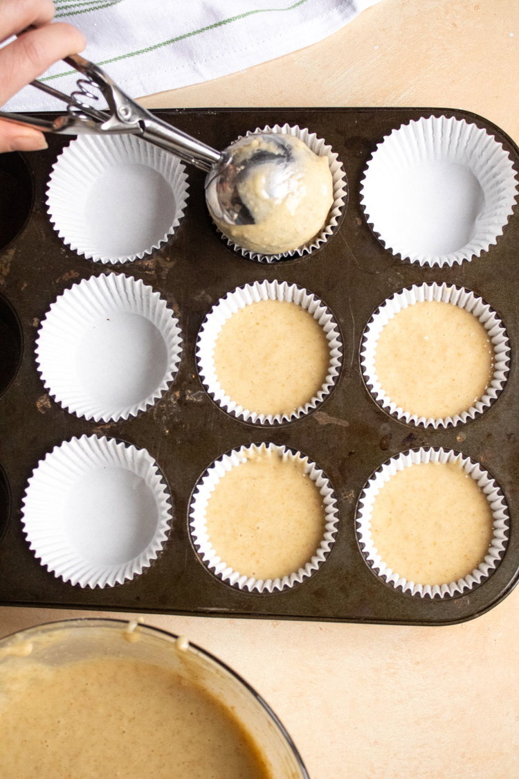 Image of Spoon into muffin tins.