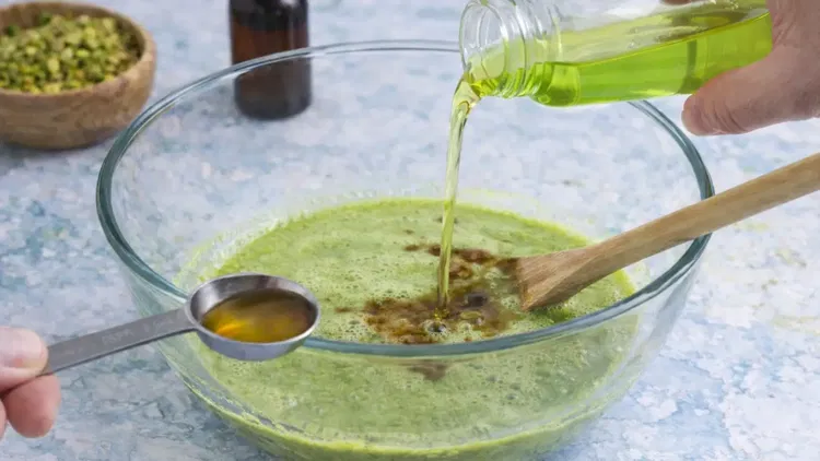 Image of Stir in the pistachio syrup and vanilla extract until fully...